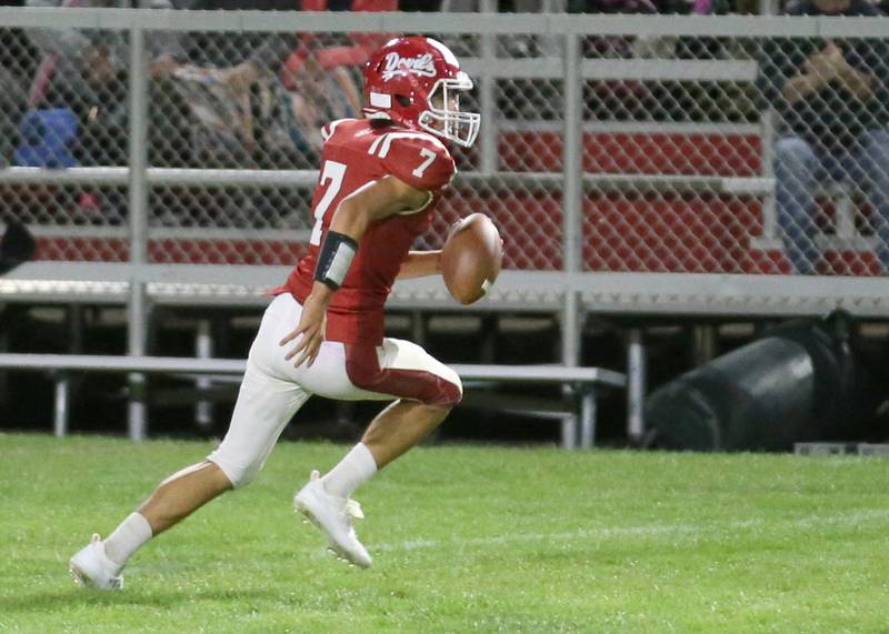 Hall quarterback Dylan Glynn runs the ball on a carry against Kewanee on Friday, Sept. 27, 2024 at Richard Nesti Stadium.