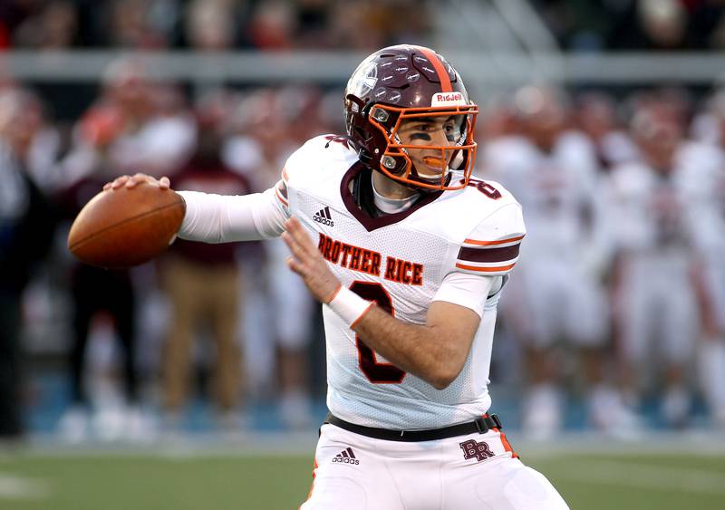 Brother Rice quarterback Jack Lausch looks to pass the ball during a Class 7A semifinal at Wheaton North on Saturday, Nov. 20, 2021.