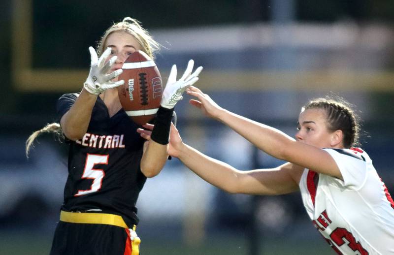 Crystal Lake Central’s Ruby Macke, left, pulls in a pass ahead of Huntley’s Aubrie Rohrbacher in varsity flag football at Owen Metcalf Field on the campus of Crystal Lake Central High School in Crystal Lake on Tuesday, Sept. 16, 2025.