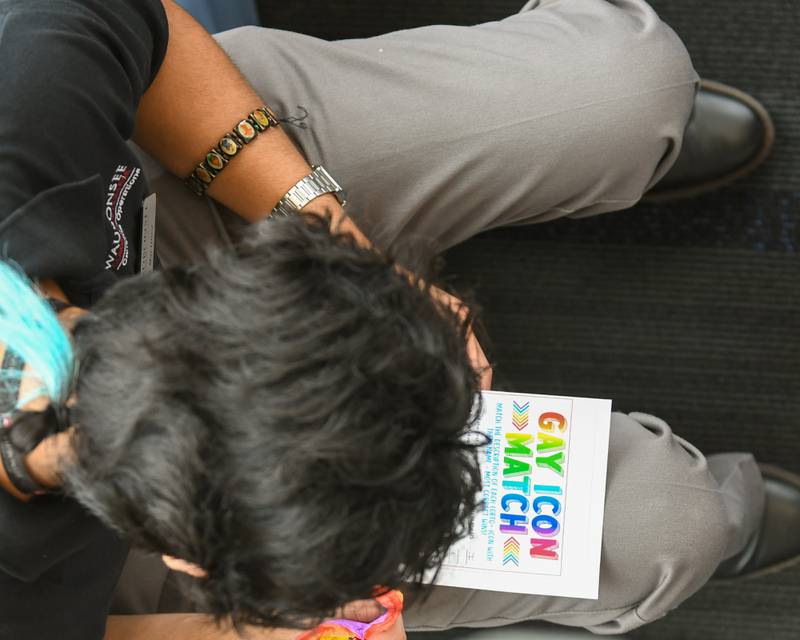 Special events assistant Raul Martinez takes part in a game during the pride party held at Waubonsee Community College at the Plano campus on Thursday June 29, 2023.
