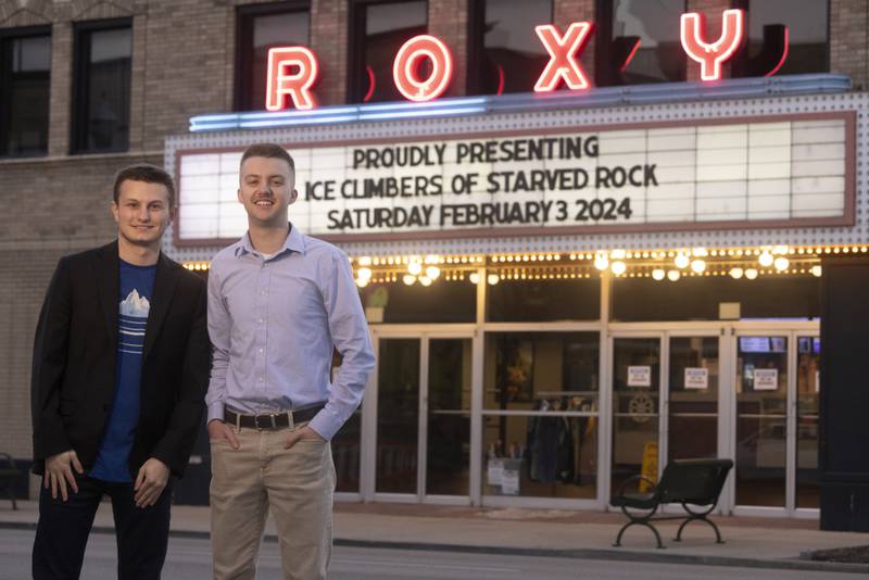 Producer Matthew Klein (left) and Director Kyle Peterson (right) pose in front of the marquee prior to the first showing of Ice Climbers of Starved Rock.