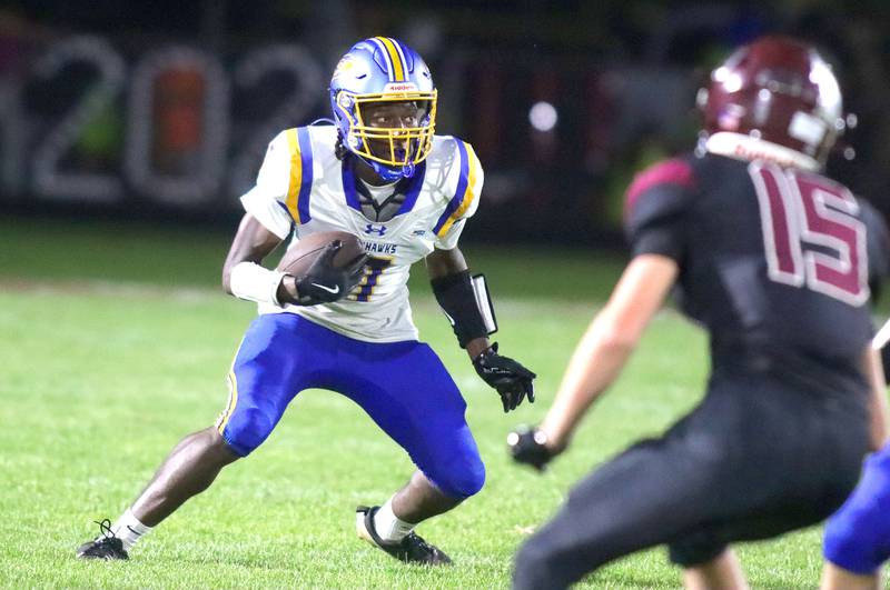 Johnsburg’s Jarrel Albea looks for running room in varsity football at Rod Poppe Field on the campus of Marengo High School in Marengo on Friday, Oct. 3, 2025.