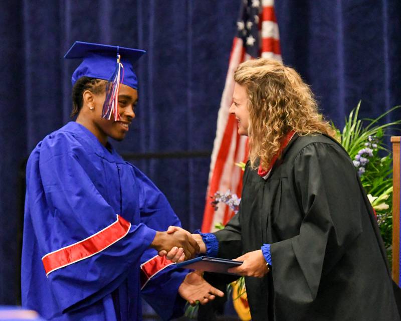 Glenbard South graduate Justin Jones receives his diploma during graduation on Thursday May 23, 2024, held at Glenbard South High School.