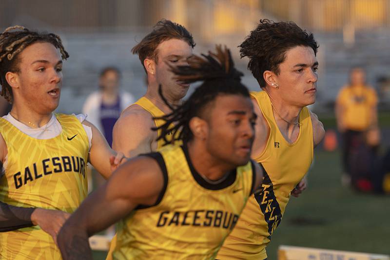 Sterling’s Cale Ledergerber (right) takes the baton for the final stretch in the 4x100 Thursday, April 27, 2023 at the Sterling Night Relays..