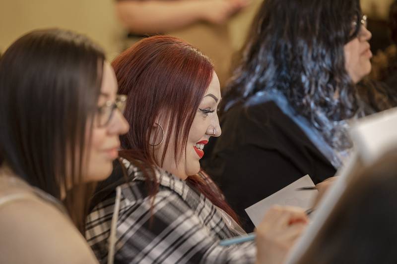 Marcy Sanchez of Dixon smiles as she works on her art Monday, April 15, 2024 in Sterling.