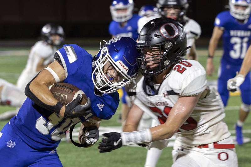Newman’s Brady Williamson blasts through Orion’s Aaron Mohr for a touchdown Friday, Sept. 20, 2024, at Roscoe Eades Stadium in Sterling.