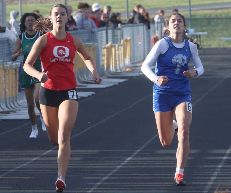 Ottawa's Sophia Hart and Princeton's Lenora hopkins run the 400 meter run during the Class 2A Sectional track meet on Wednesday, May 13, 2026 in the Jeff Prusator Athletic Complex at Mendota High School.