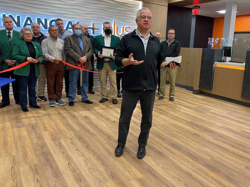 Financial Plus President/CEO Tim O'Donnell addresses a crowd of employees and the public during the 2022 ribbon cutting ceremony for the new Ottawa headquarters.