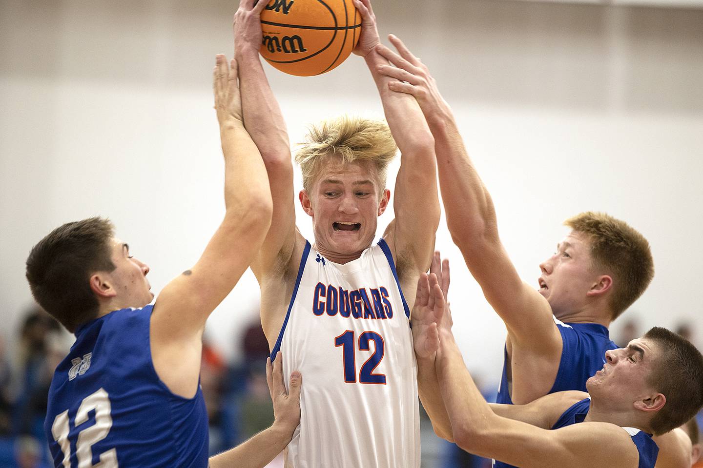 Eastland’s Adam Awender pulls down a rebound against Newman Tuesday, Dec. 10, 2024, at Eastland High School.
