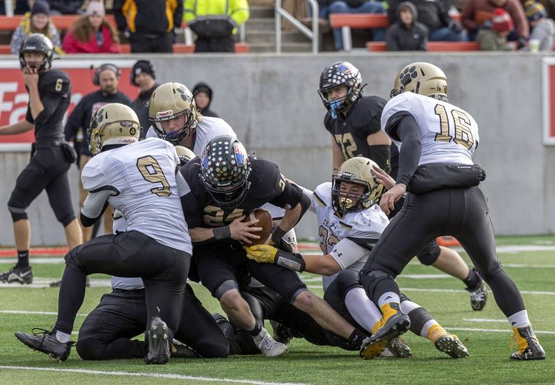 Lena-Winslow's Lucas Fye fight for yards against Camp Point Friday, Nov. 24, 2023 in the 1A state football championship game at Hancock Stadium in Normal.