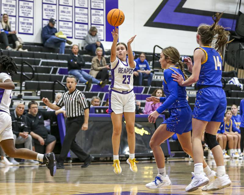 Plano's Josie Larson (23) shoots a three during their basketball game between Johnsburg at Plano, Monday Dec 16, 2024 in Plano.