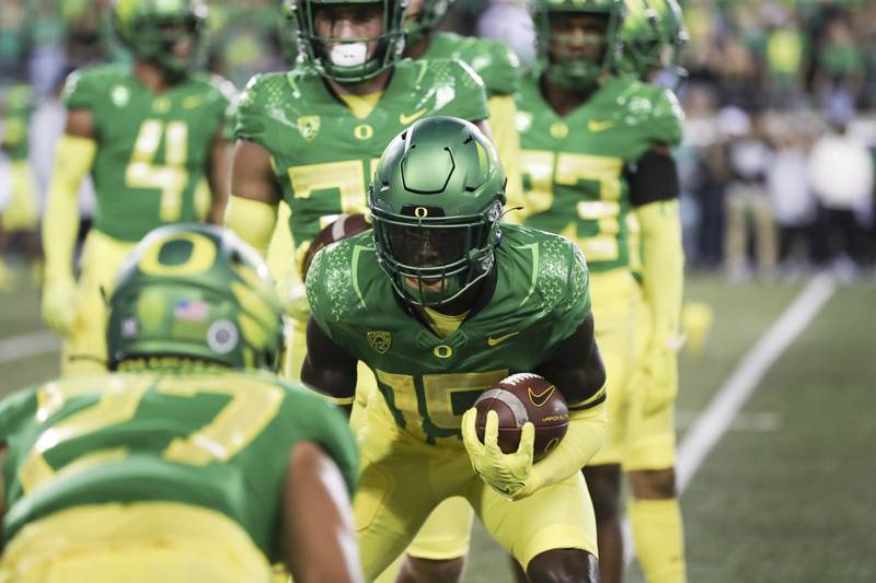 Oregon wide receiver Isaiah Brevard (15) warms up prior to an NCAA football game against Stanford on Saturday, Oct. 1, 2022, in Eugene, Ore. Oregon won 45-27. (AP Photo/Amanda Loman)