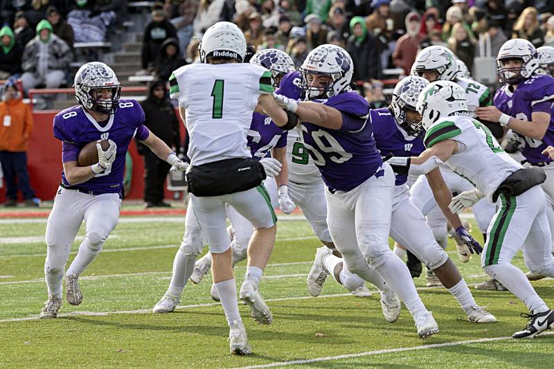 Wilmington's Kyle Farrell looks for running room against Athens Friday, Nov. 24, 2023 in the 2A state football championship game at Hancock Stadium in Normal.