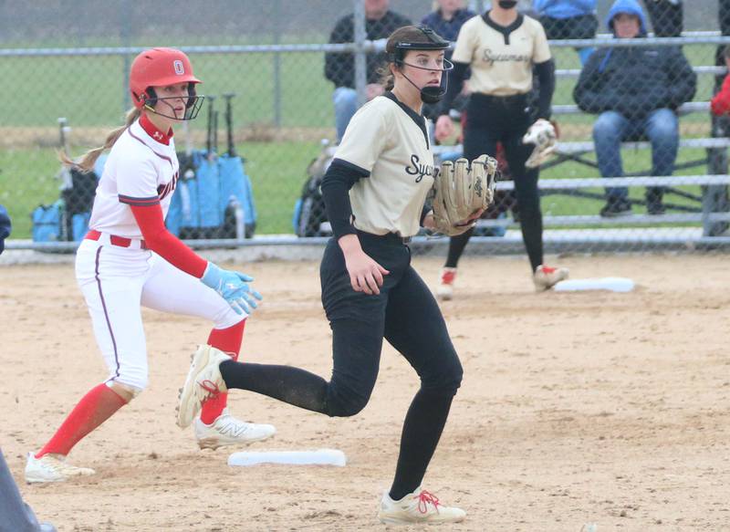 Ottawa's Teagan Darif steals second base as the ball gets by Sycamore's Callie Countryman on Tuesday, May 5, 2026 at Peck Park in Ottawa.