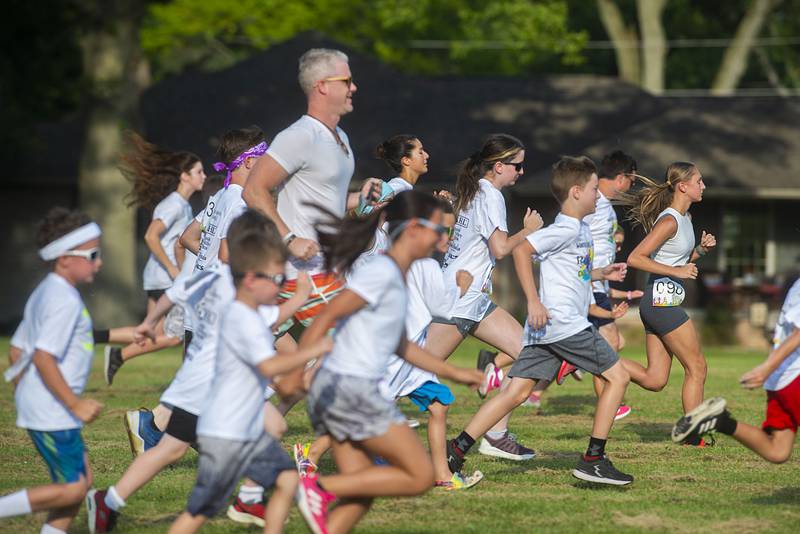 It’s a good clean start for runners in the Woodlawn Arts Academy ROY G BIV color fun run Saturday, August 6, 2022. 150 runners signed up to participate in the colorful event.