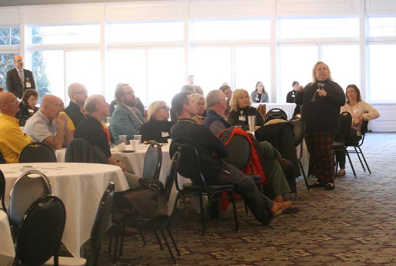 Dawn Trompeter president of OSF Health Care Saint Elizabeth Medical Center (right) delivers a speech to about a hundred people during the OSF Community Breakfast Regional Update on Tuesday, Nov. 28, 2023 at Senicas Oak Ridge in La Salle.
