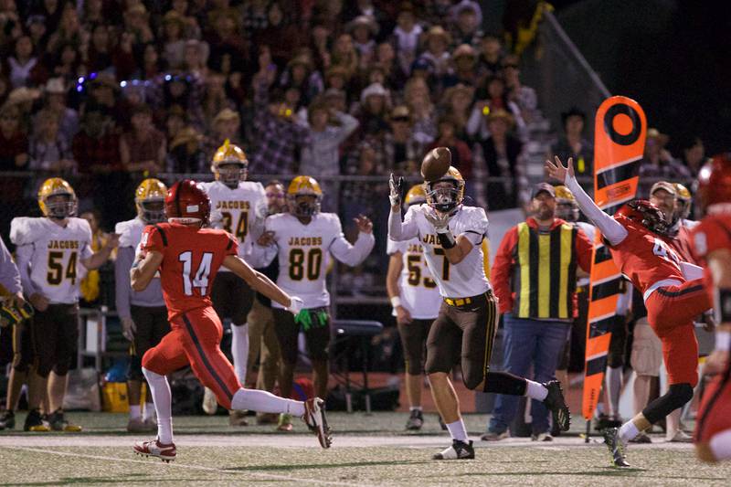 Jacob's Dylan Burgstiner makes the running catch against Huntley on Friday, Sept. 23,2022 in Huntley.