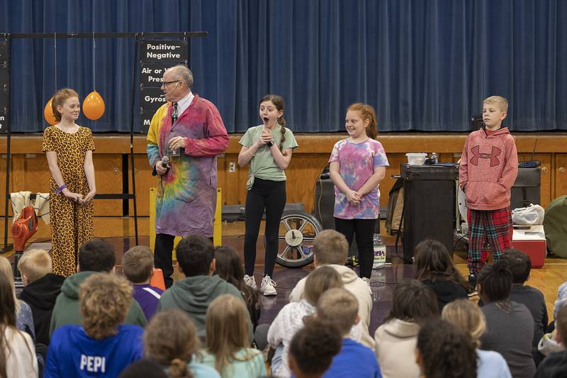 Madison School students help Steve Belliveau in his “Getting Excited About Science” program held at the school Friday, March 7, 2025. The school was celebrating the end of the quarter and rewarding the students for their achievements and encouraging them to continue to do their best.