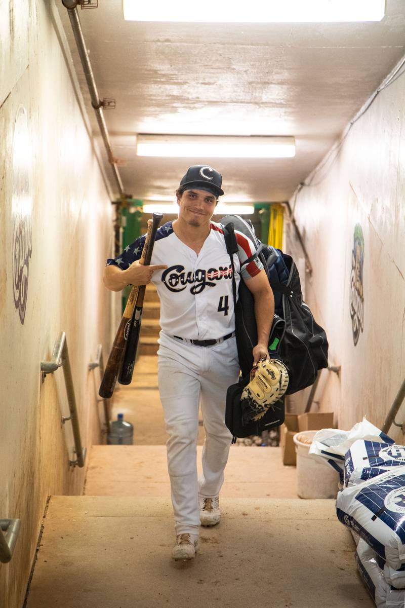 Catcher Josh Rolette (4) brings his gear to the locker room after a game against the Lake Country DockHounds at Northwestern Medicine Field on Saturday, July 2, 2022.