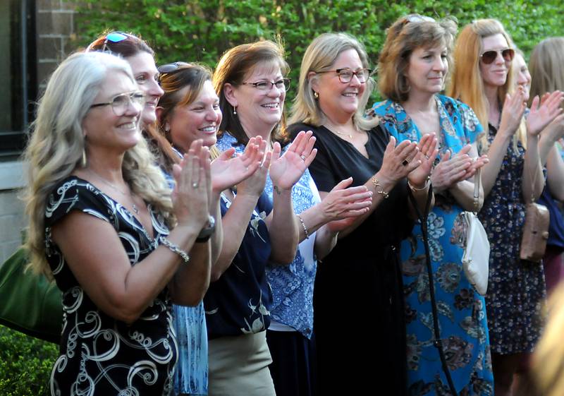 Haber Oaks staff members clap for the graduates Thursday, May 12, 2022, during the Haber Oaks Campus graduation in the courtyard of Crystal Lake South High School.