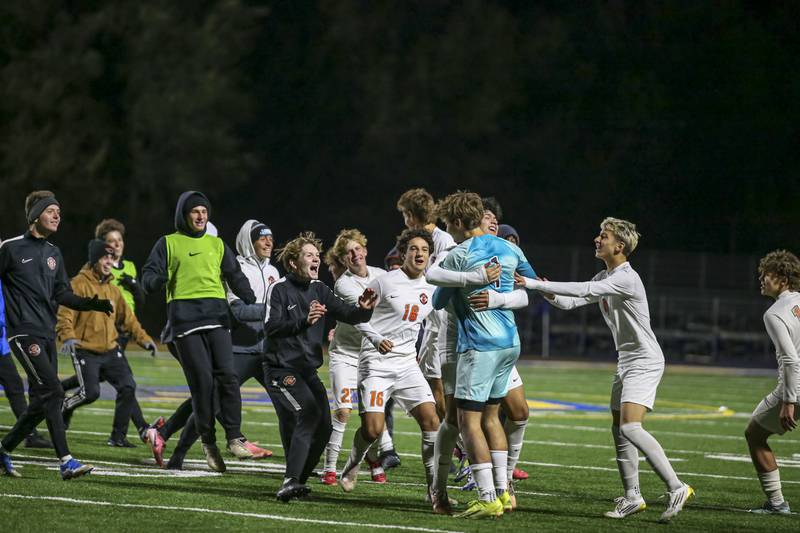 Lincoln-Way West rushes the pitch to celebrate their win over Joliet Central in their Class 3A Joliet Central Regional semifinal soccer match between Lincoln-Way West at Joliet Central, Wednesday Oct 22, 2025.