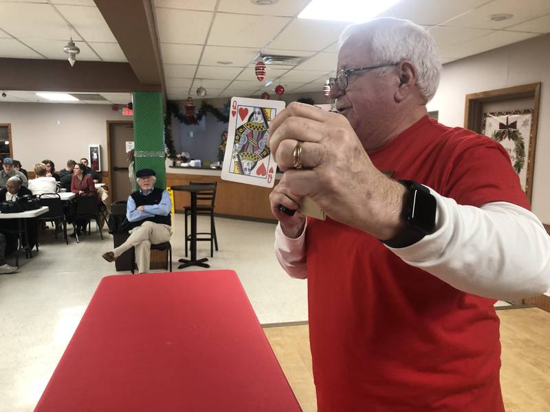 Larry Cannon holds up the Queen of Hearts on Tuesday, Jan. 31, 2024. The McHenry VFW Post 4600 closed out the year with a winner in its Queen of Hearts raffle. The winner took home half if the $2.5 million pot.