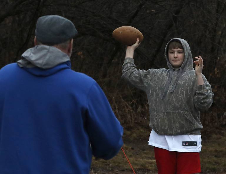 Big bother Dave toss a football around with his little brother, Chase, 13, on Thursday, Jan 20, 2023 in Crystal Lake as they hang out to gather. The two are are part of the Big Brothers Big Sisters of McHenry program.