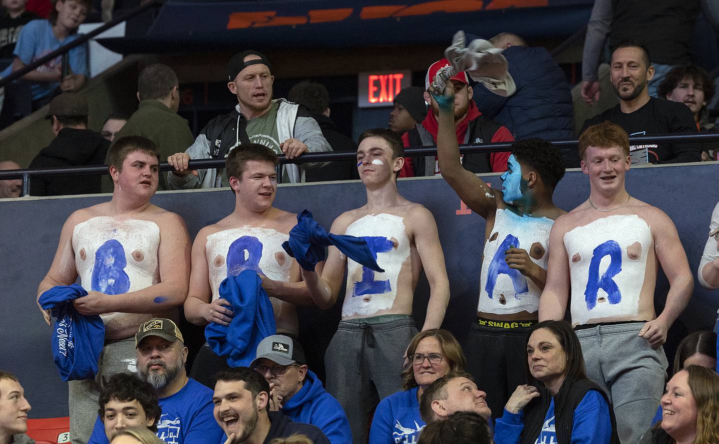 Newman fans cheer on Briar Ivey as he takes on Riverdale’s Blake Smith in the 157 pound weight class of the 1A state individual wrestling finals Saturday, Feb. 22, 2025, at State Farm Center in Champaign.