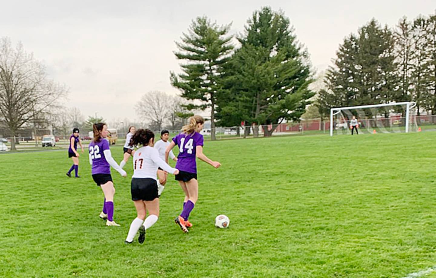 Dixon's Maggie Van Sickle (14) dribbles the ball as DeKalb's Natalie Delgado (17) chases her on Thursday, May 5, 2022.