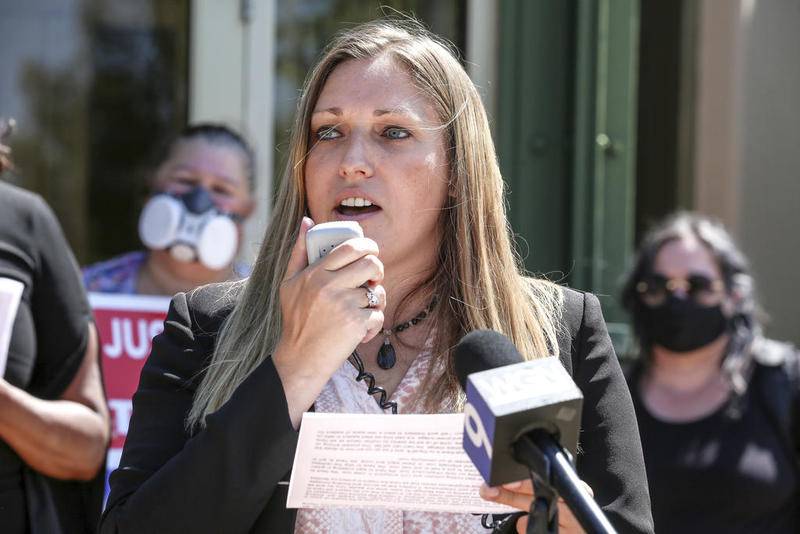 Will County Board Member Rachel Ventura, a member of Working Families Joliet, speaks to members of the public and media Aug. 21 outside Joliet City Hall in downtown Joliet.