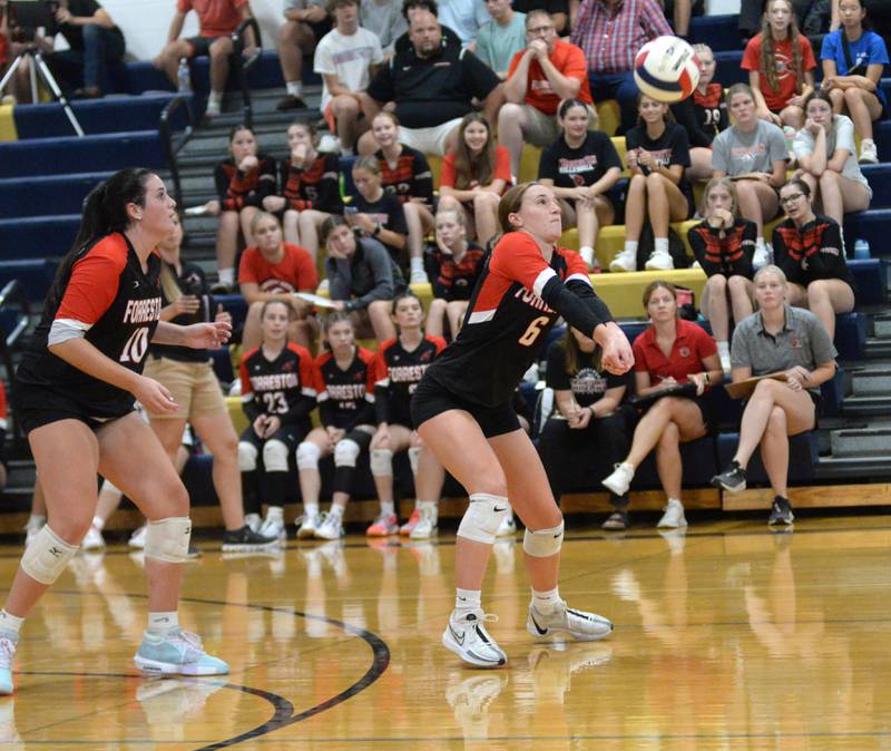 Forreston's Breelyn Schneiderman (6) returns a Polo serve as Jaiden Schneiderman (10) watches during a Wednesday, Aug. 28, 2024 match at Polo High School.