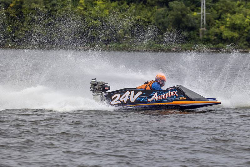 Dan Keylard races through the spray of other boaters Saturday, Aug. 17, 2024, during a heat in the Rock Falls River Chase.