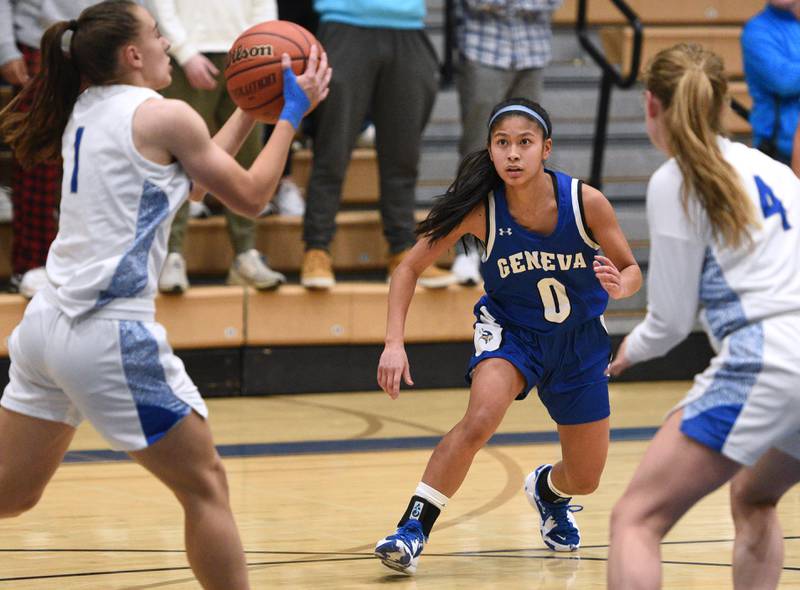 Geneva's Rilee Hasegawa (0) pressures the St. Charles North offense during Thursday’s girls basketball game in St. Charles.
