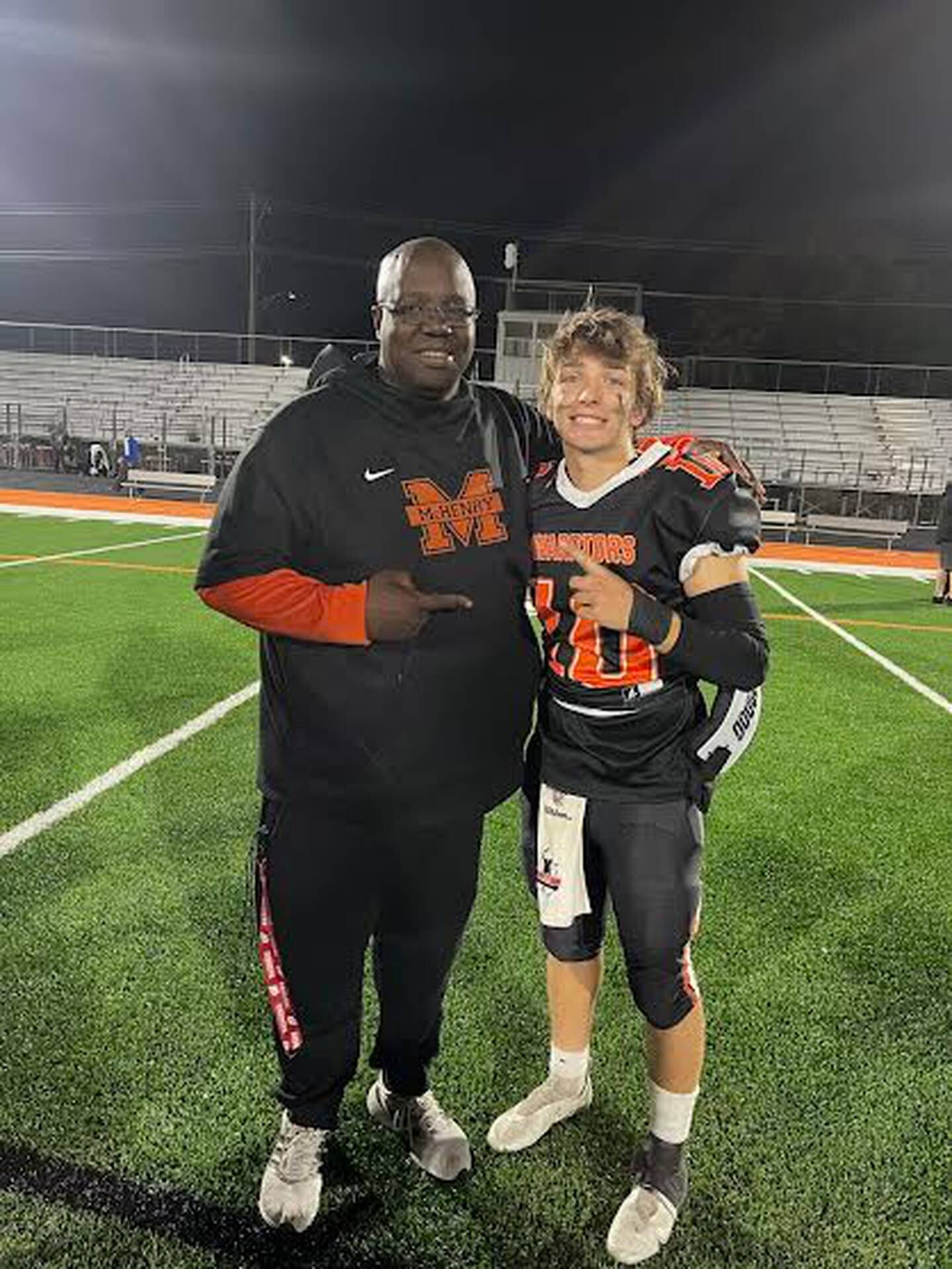 Former McHenry AD and football coach with quarterback Dom Caruso.