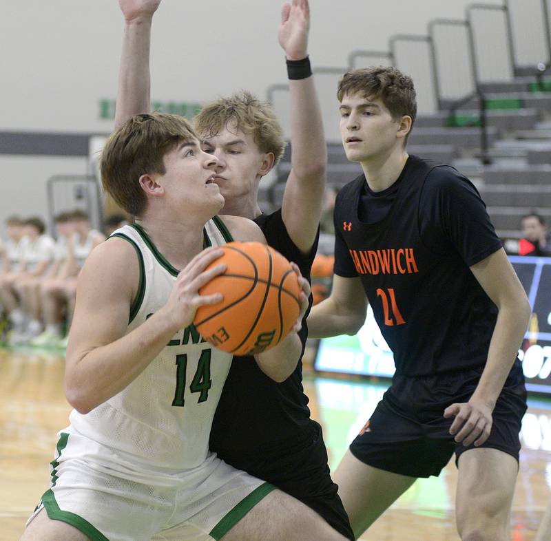 Seneca’s Cam Shriey eyes the basket as Sandwich’s Wyatt Koley blocks his path  in the 2nd period Saturday during the MLK Shootout at Seneca.