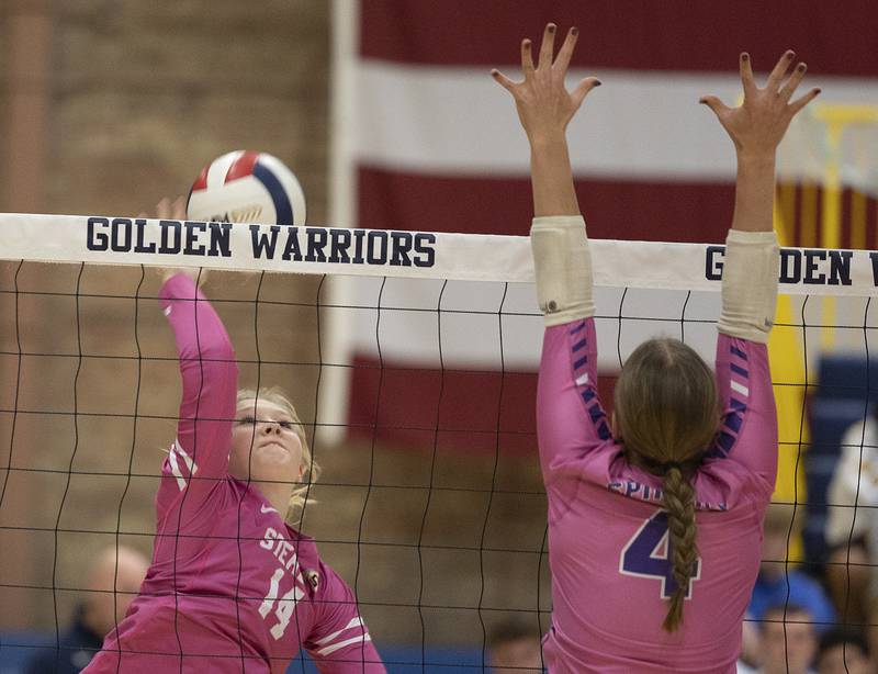 Sterling’s Emma Sinn spikes against Mendota’s Laylie Denault Thursday, Oct. 24, 2024, in Sterling.