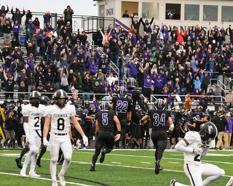 Downers Grove North fans cheer after winning the second week class 7A game over Fenwick from a field goal in the last seconds of the game on Saturday Nov. 9, 2024, held at Downers Grove North High School.