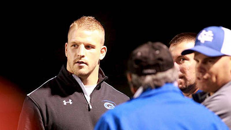 Former Geneva standout Pat Schiller, who most recently played on the Atlanta Falcons practice squad, talks on the sideline Sept. 13 before Geneva’s game against Batavia.