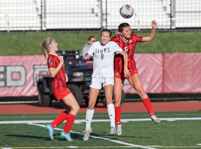 Lyons Township's Carolina Capizzi (8) and Hinsdale Central's Julia Marinaccio (6) go up for the ball during the girls varsity soccer match between Lyons Township and Hinsdale Central high schools in Hinsdale on Tuesday, April 18, 2023.