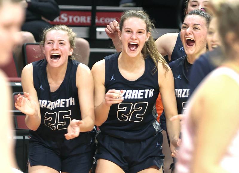 Nazareth's Amalia Dray and Gracie Carstensen celebrate as time ticks down in their win over Morton in the Class 3A state semifinal game Friday, March 4, 2022, in Redbird Arena at Illinois State University in Normal.