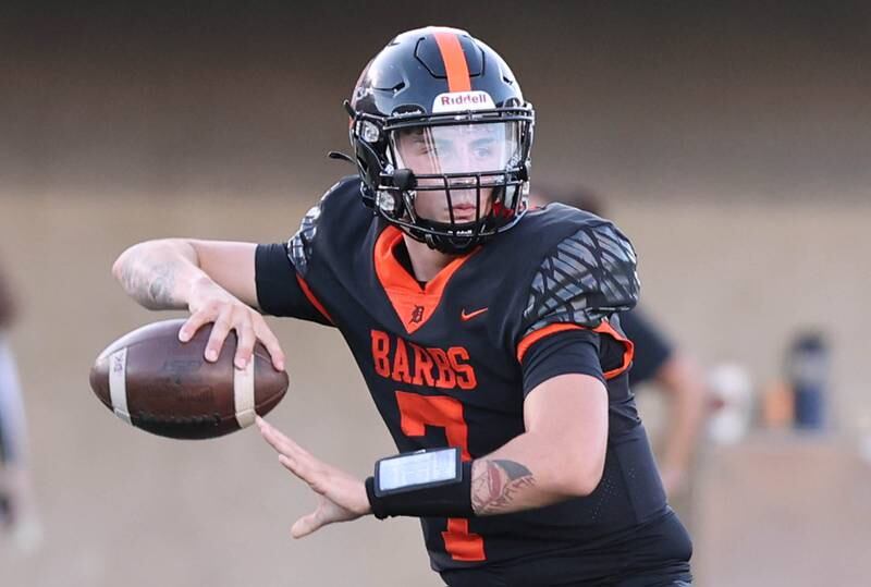 DeKalb's Adrien McVicar looks for a receiver during the First National Challenge against Sycamore Friday, Aug. 26, 2022, in Huskie Stadium at Northern Illinois University in DeKalb.