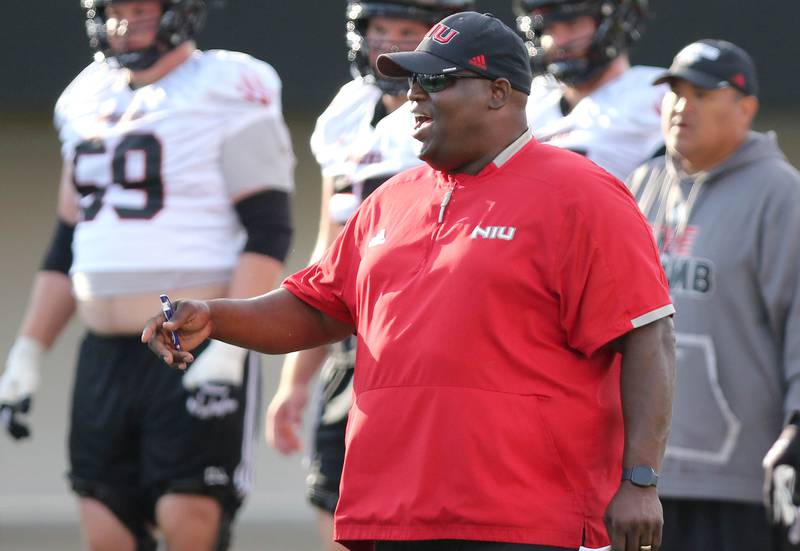 Northern Illinois football head coach Thomas Hammock talks to his team during the first practice of the season Wednesday, Aug. 2, 2023, at Huskie Stadium in DeKalb.