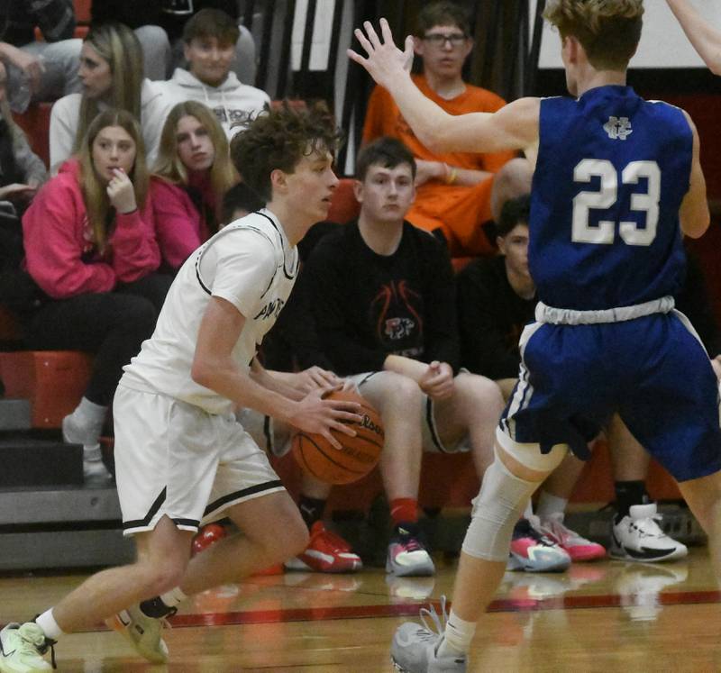 Erie-Prophetstown's Connor Keegan dribbles as Newman's Lucas Simpson defends during.a Friday, Dec. 29, 2023 game at the Warkins Memorial Tournament at Erie High School.