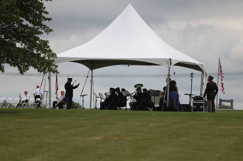 The IL Army National Guard’s 144th Army Band performs for the National Cemetery Administration 50th Anniversary ceremony at the Abraham Lincoln National Cemetery in Elwood on Saturday, July 29.