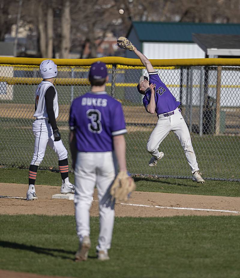 Dixon’s Quentin Seggebruch reaches back to catch a pop fly for an out against Winnebago Thursday, April 6, 2023.