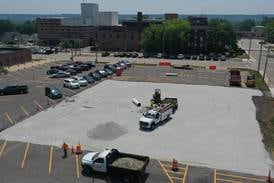 Photos: Crews pave parking lot at OSF St. Elizabeth in Peru 