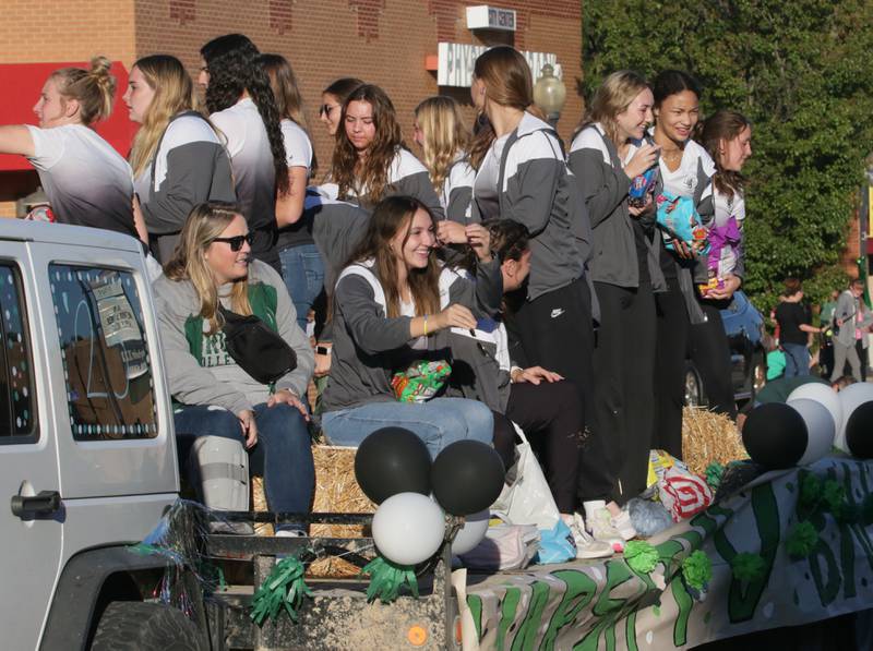 St. Bede volleyball players ride in the Homecoming parade on Friday, Sept. 30, 2022 downtown Peru.