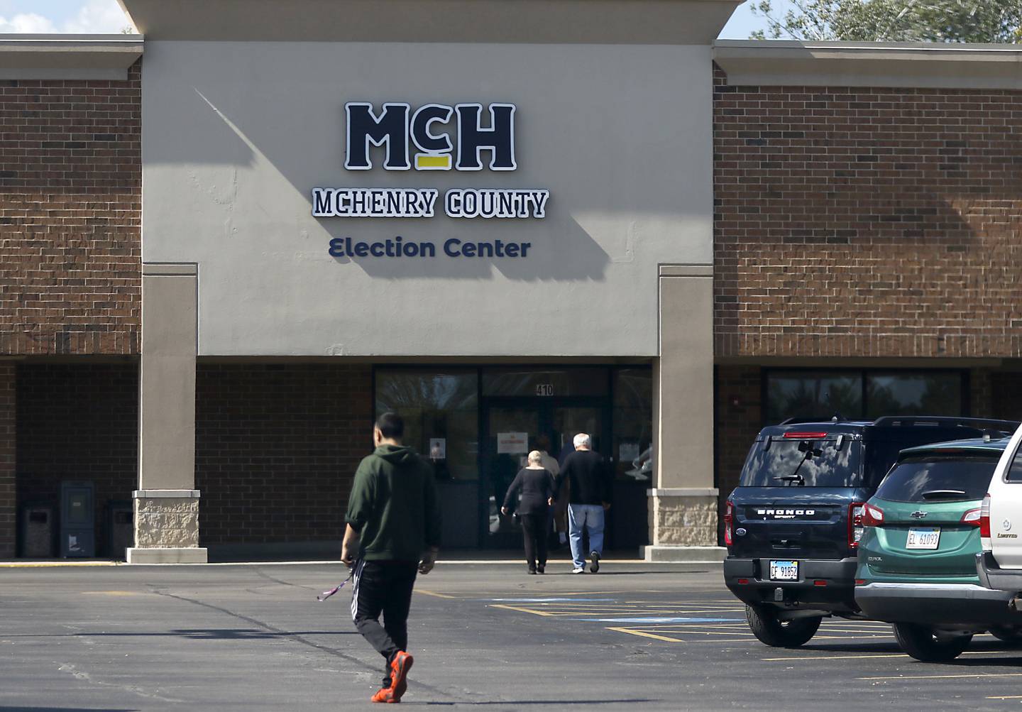 People walk into the McHenry County Election Center to vote on Thursday Sept. 26, 2024, during the first day of early voting in McHenry County,