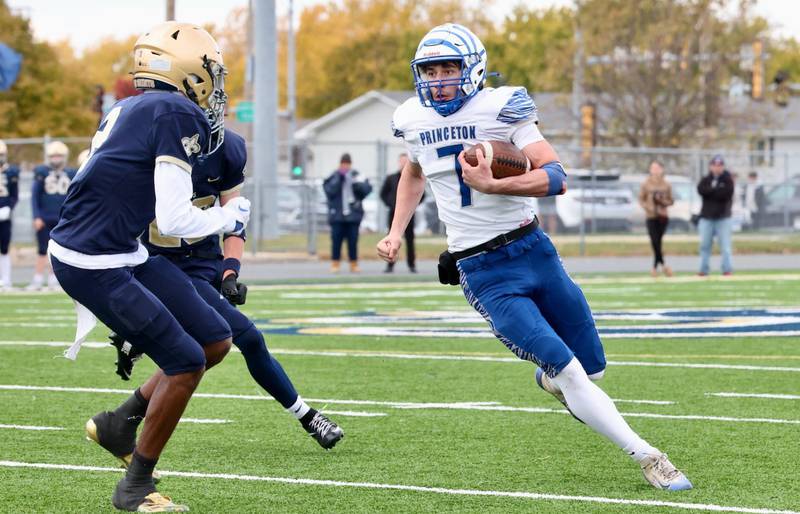 Princeton's Gavin Lanham carries the ball against Bloomington Central Catholic in Saturday's 3A playoff opener in Bloomington.