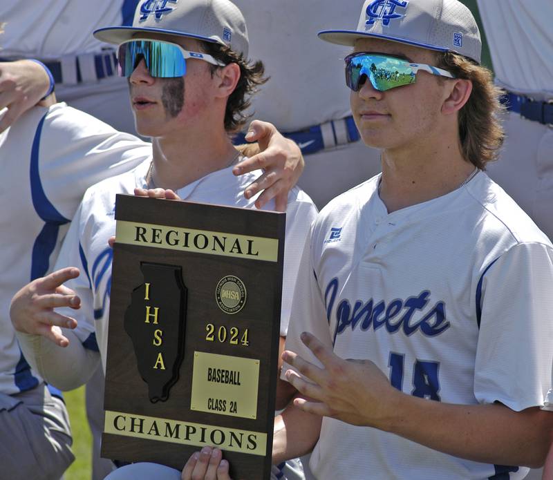 Newman players pose with the 2A championship plaque following the 2A Regional baseball game at Larry Ybarra field at Newman High School, Saturday, May 18th 2024.